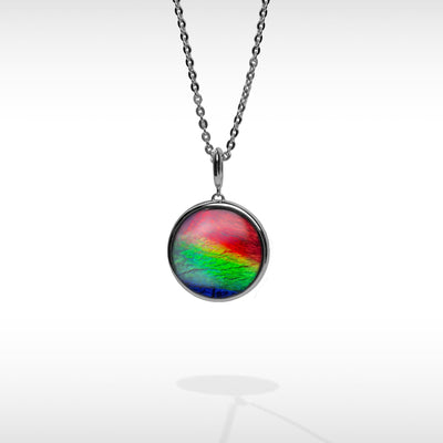 Origins round ammolite pendant,earring and ring set in sterling silver