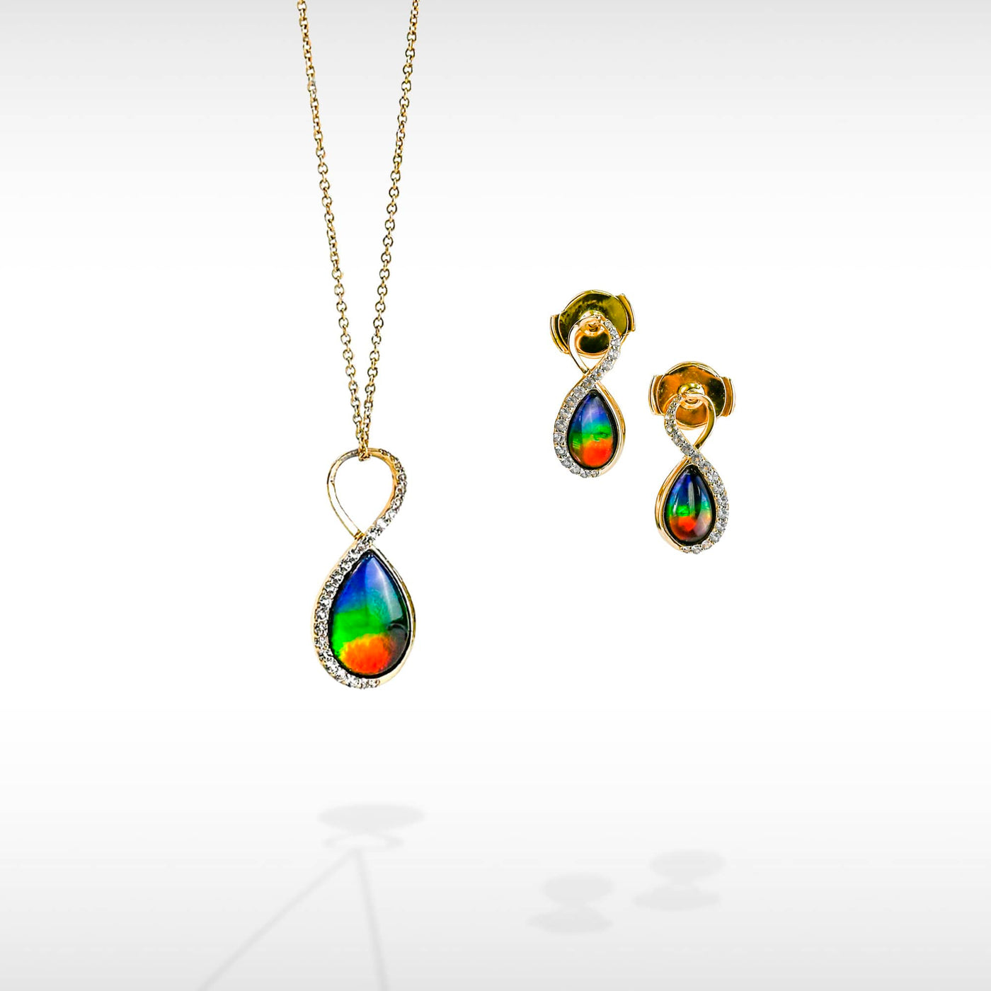 Infinity ammolite pendant and earring set with white diamonds in 14K gold