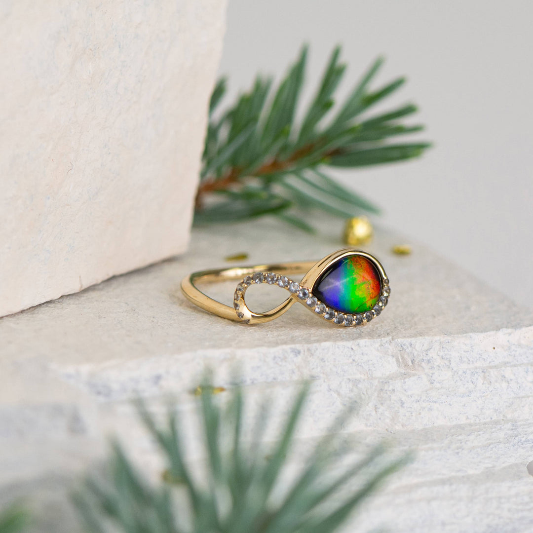 Infinity ammolite ring in 14K gold with white diamonds