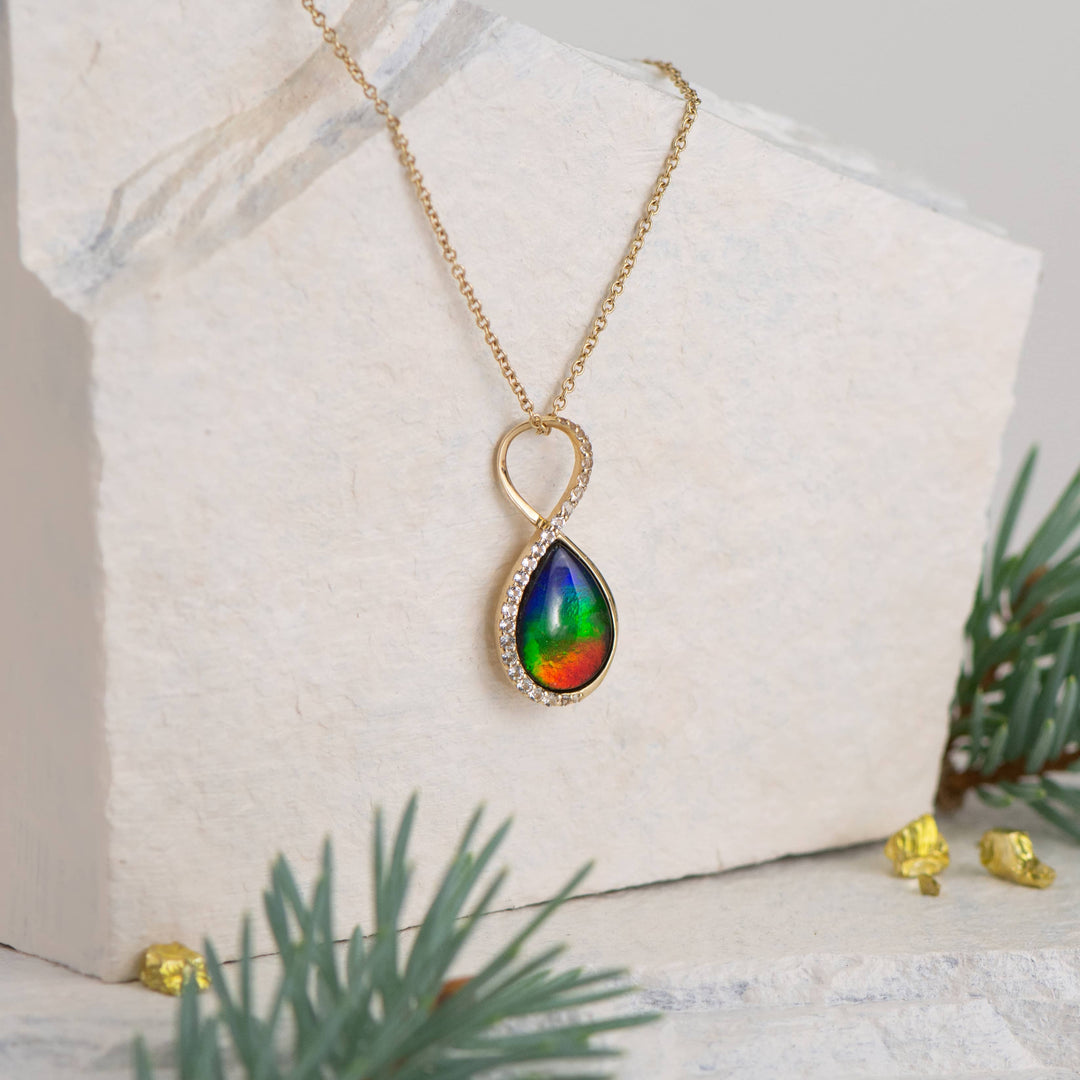 Infinity ammolite pendant in 14K gold with white diamonds