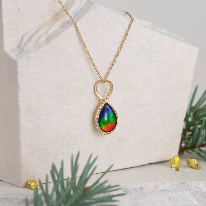 Infinity ammolite pendant in 14K gold with white diamonds