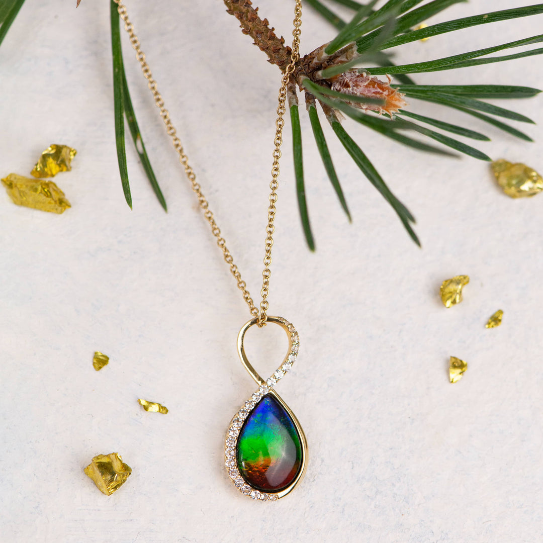 Infinity ammolite pendant in 14K gold with white diamonds