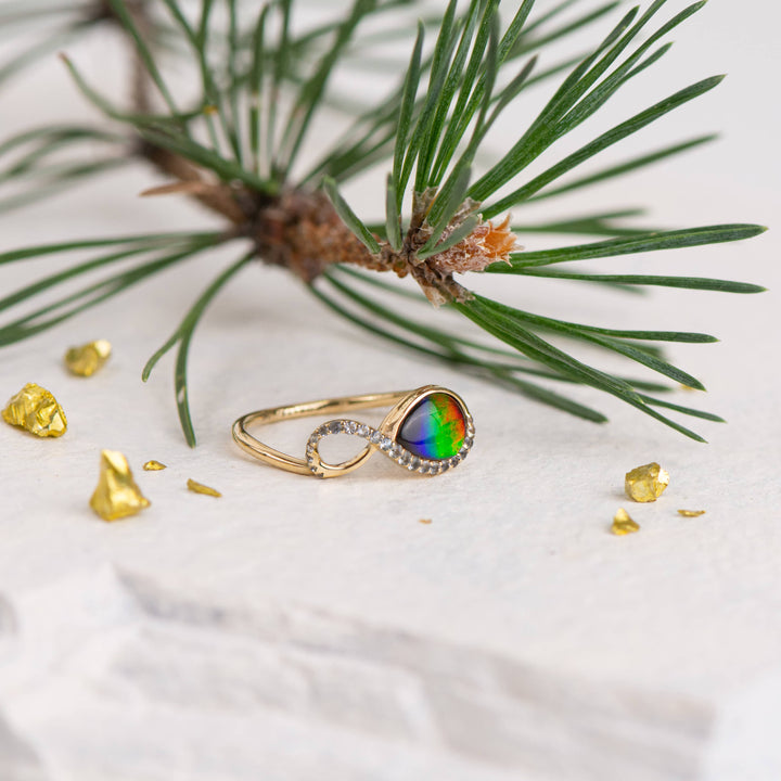 Infinity ammolite ring in 14K gold with white diamonds